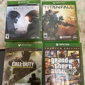 Lot of 4 Xbox One Games Grand Theft Auto 5 COD Infinite Warfare Titanfall Halo 5